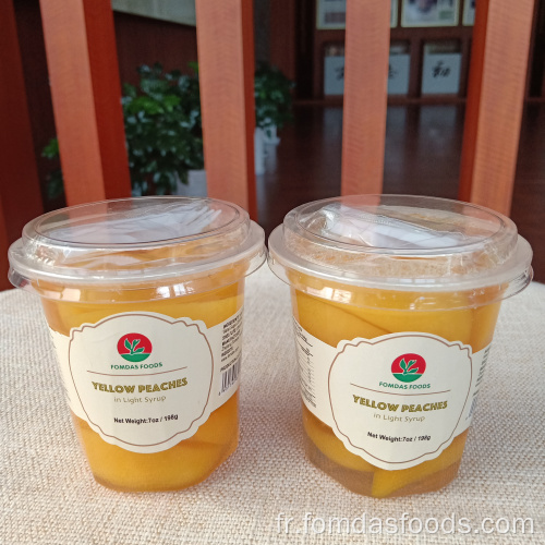 Peaches jaunes en jus de poire 198g